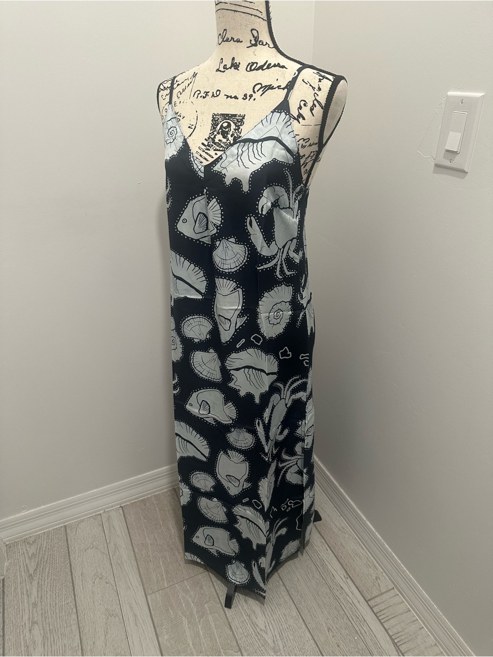 Kenny Flowers Black Maxi Dress with White Shell Print. Adjustable straps.